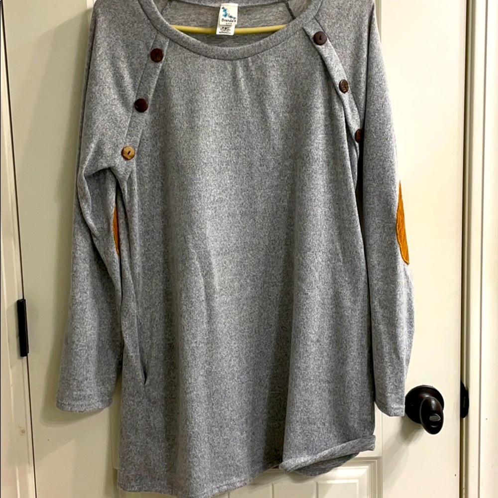 Tunic style sweater with button detail